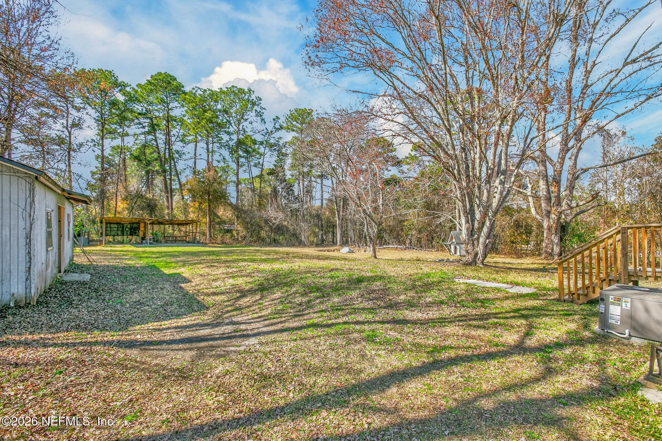 69 Azalea Avenue Middleburg, FL 32068 - Photo 36 of 41 a view of a yard with yellow house