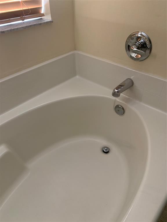 3190 Southwest Curcuma Street Port St. Lucie, FL 34953 - Photo 11 of 19 a bathroom with a bathtub