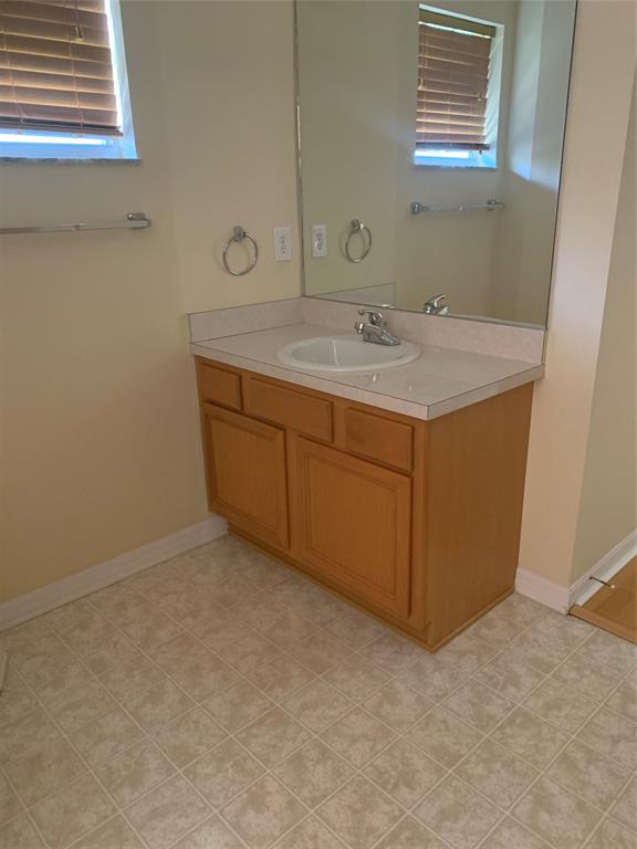 3190 Southwest Curcuma Street Port St. Lucie, FL 34953 - Photo 12 of 19 a bathroom with a sink and a mirror