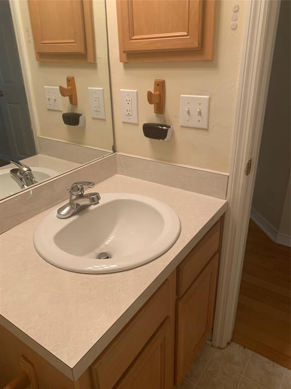 3190 Southwest Curcuma Street Port St. Lucie, FL 34953 - Photo 16 of 19 a bathroom with a sink and a mirror