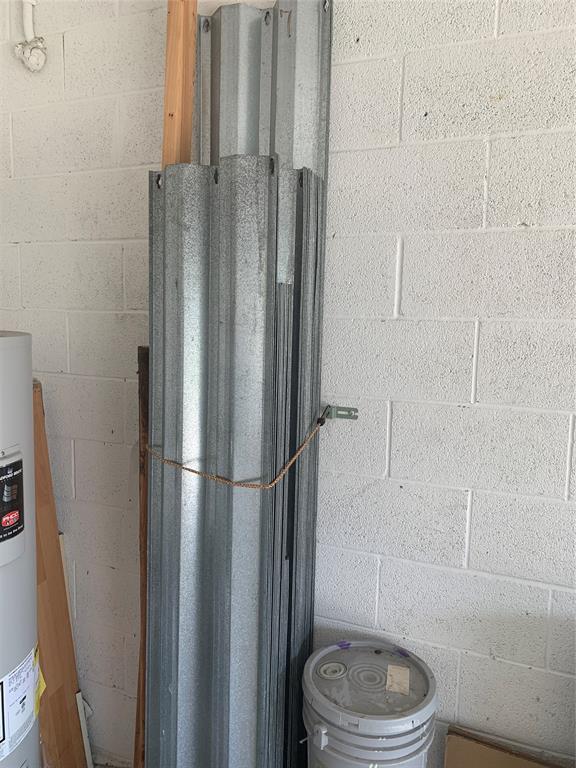 3190 Southwest Curcuma Street Port St. Lucie, FL 34953 - Photo 18 of 19 a bathroom with a toilet and a shower