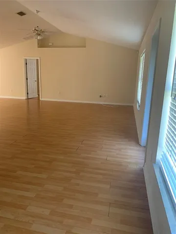 a view of room with wooden floor