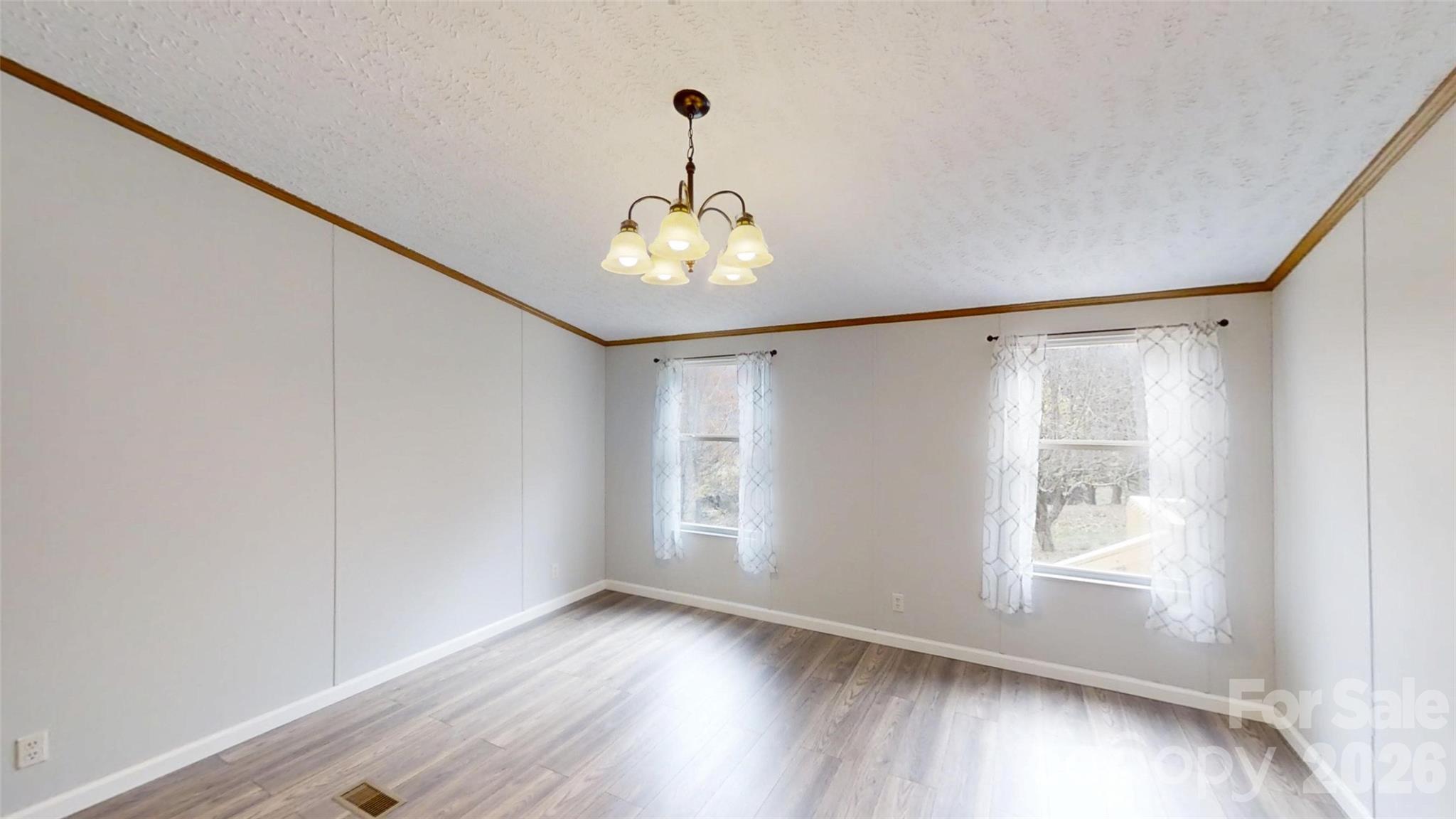 71 London Lane Clyde, NC 28721 - Photo 20 of 33 a very nice looking room with wooden floor and windows