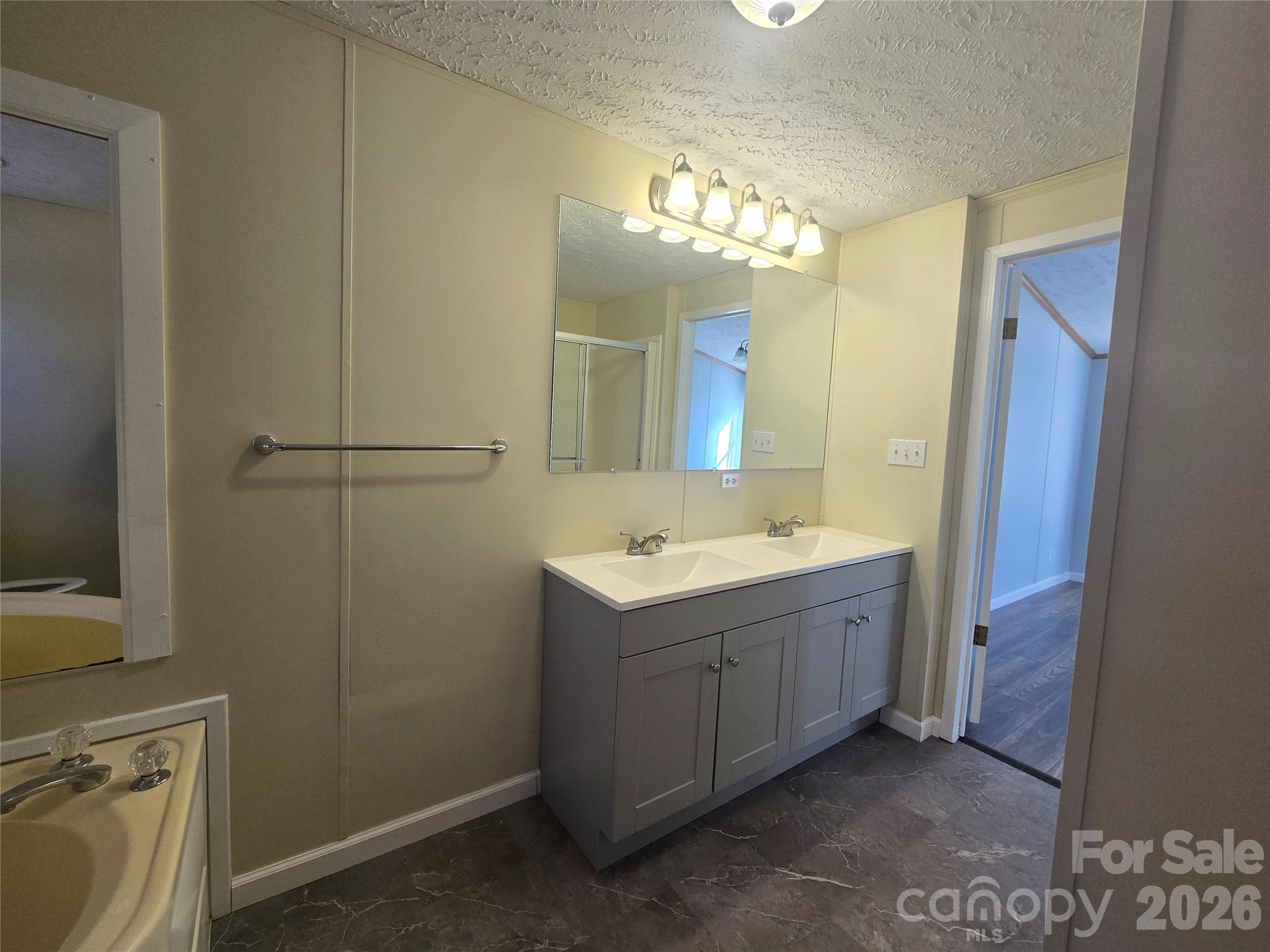 71 London Lane Clyde, NC 28721 - Photo 24 of 33 a view of a bathroom with a sink and mirror