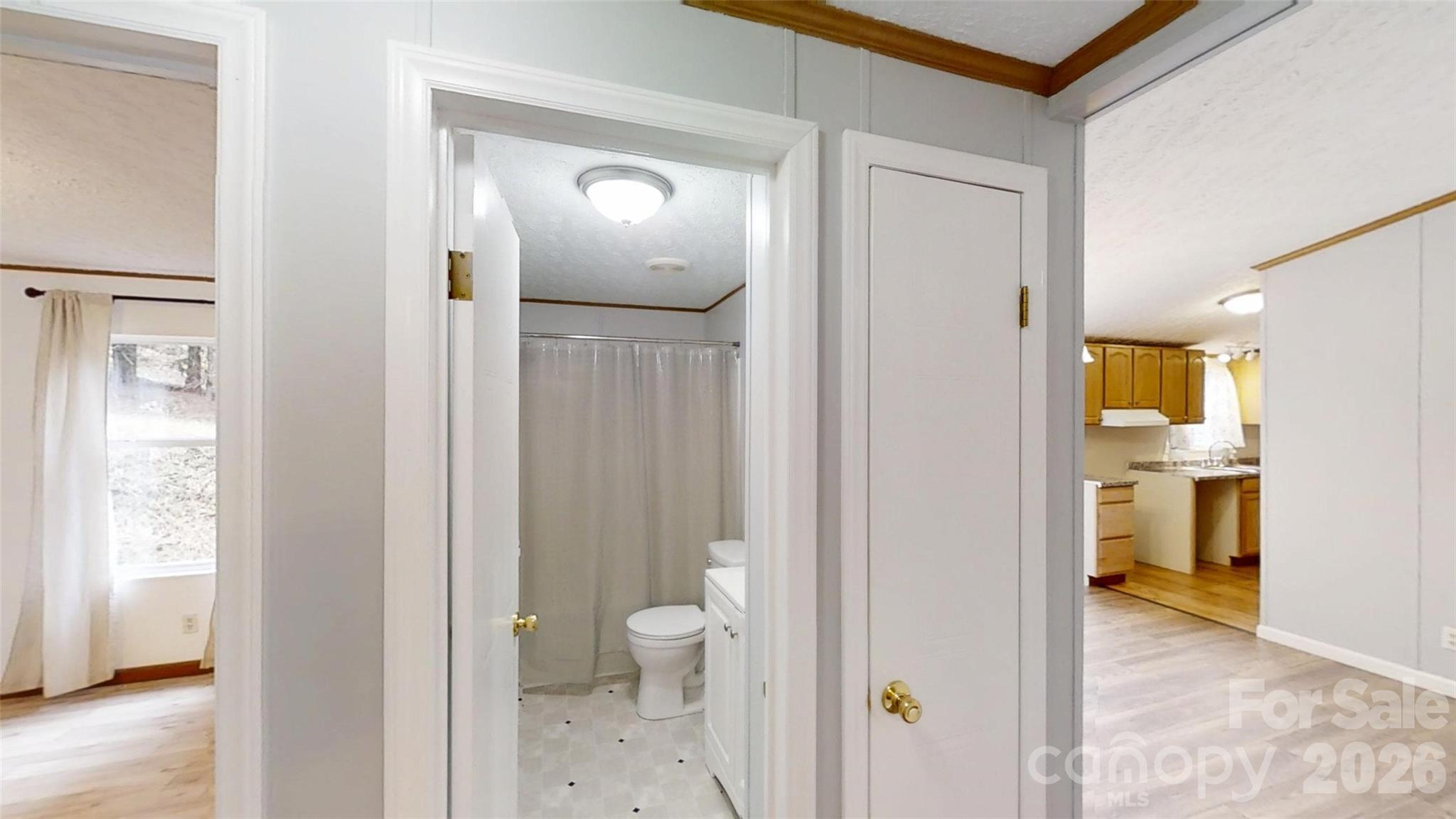 71 London Lane Clyde, NC 28721 - Photo 26 of 33 a view of a bathroom from a hallway