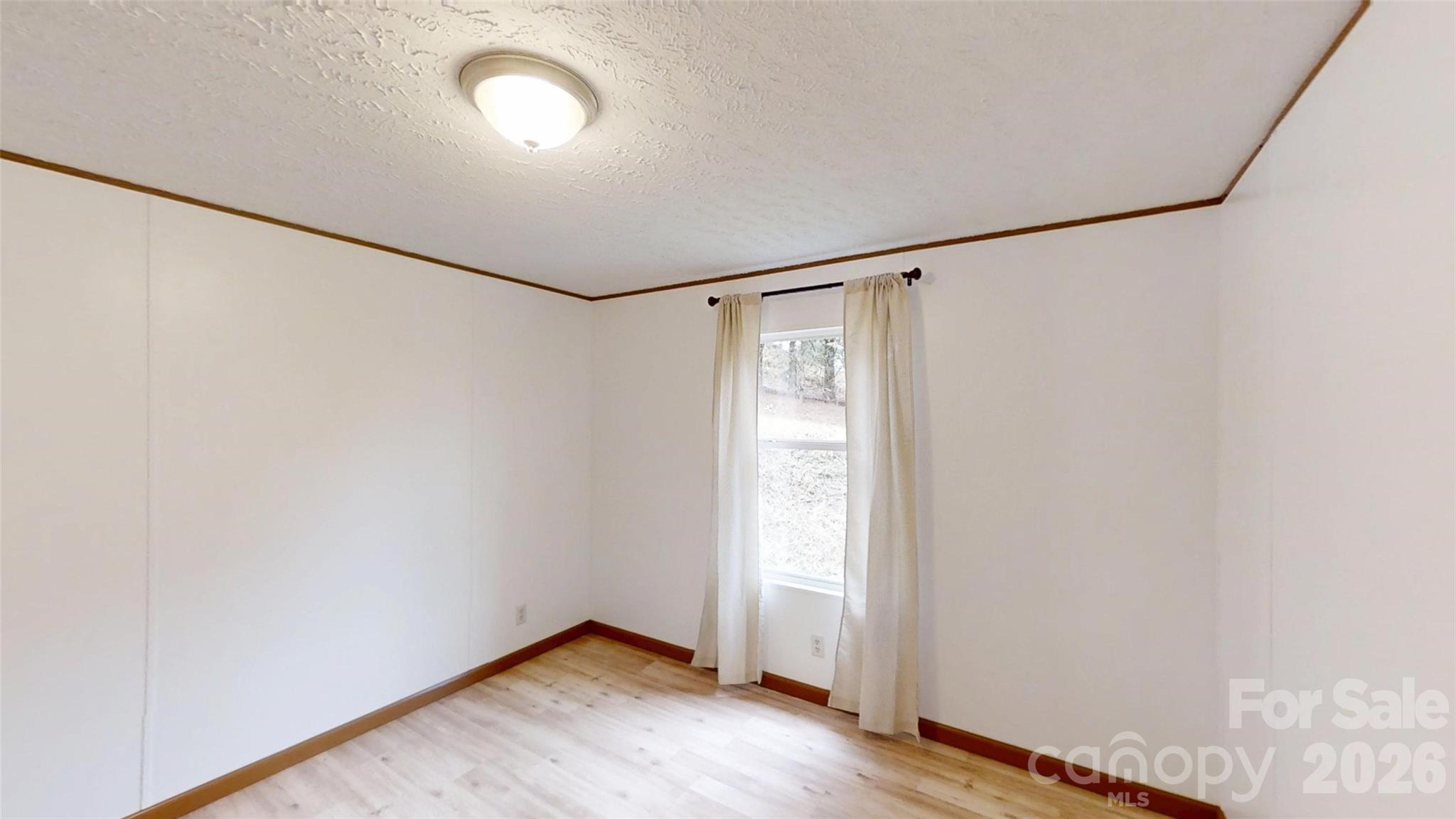71 London Lane Clyde, NC 28721 - Photo 29 of 33 a view of a room with wooden floor