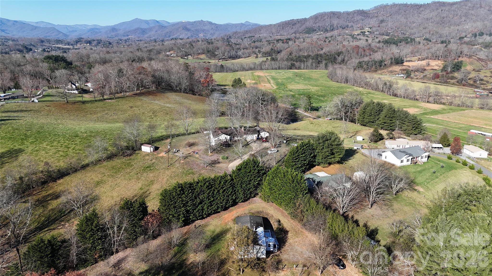 71 London Lane Clyde, NC 28721 - Photo 7 of 33 a view of a lush green hillside and houses