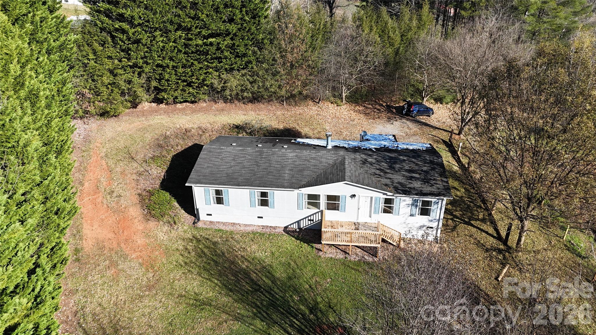71 London Lane Clyde, NC 28721 - Photo 8 of 33 an aerial view of residential house with outdoor space and trees all around