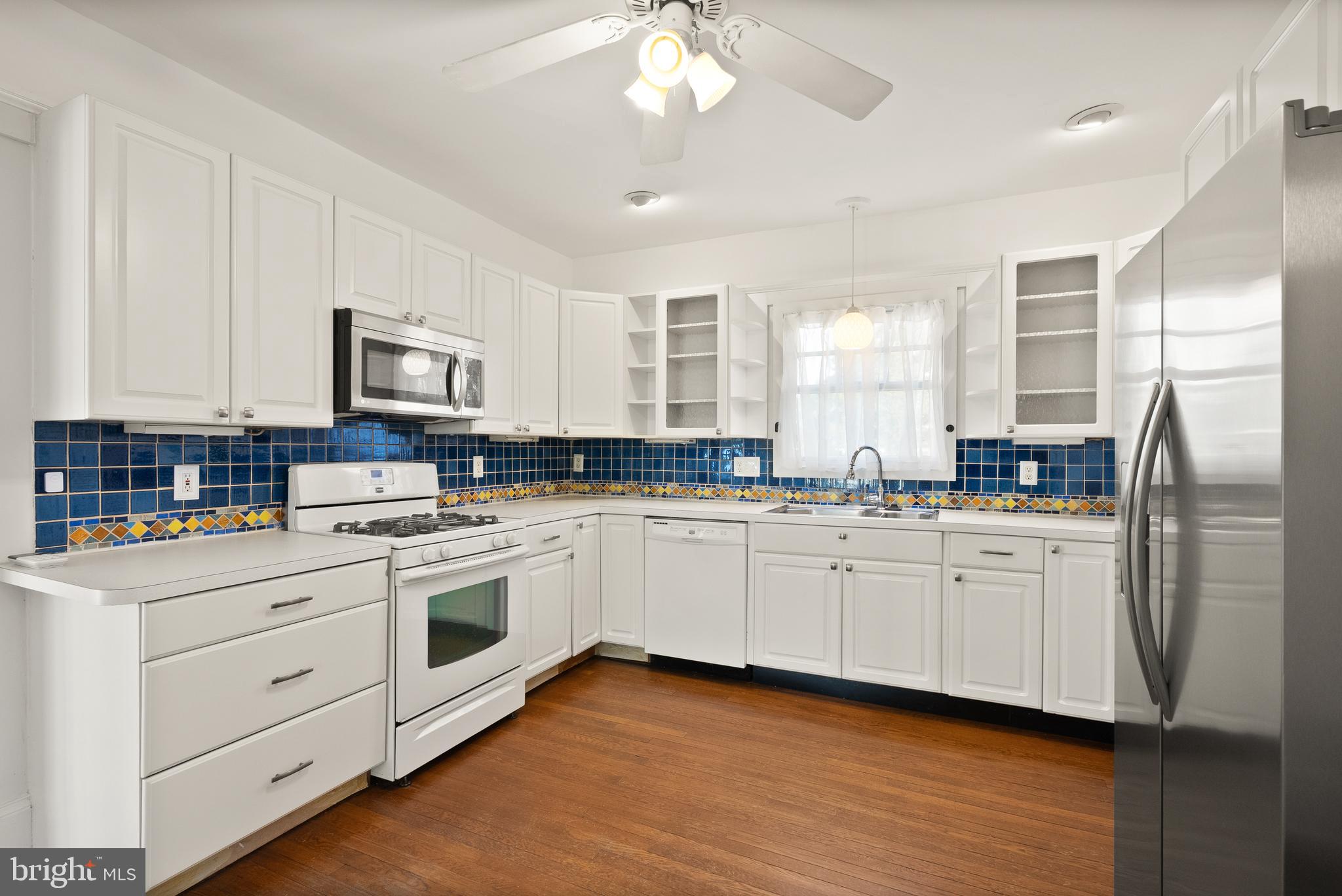820 Locust Street Herndon, VA 20170 - Photo 14 of 55 a kitchen with stainless steel appliances granite countertop a stove a sink dishwasher and a refrigerator