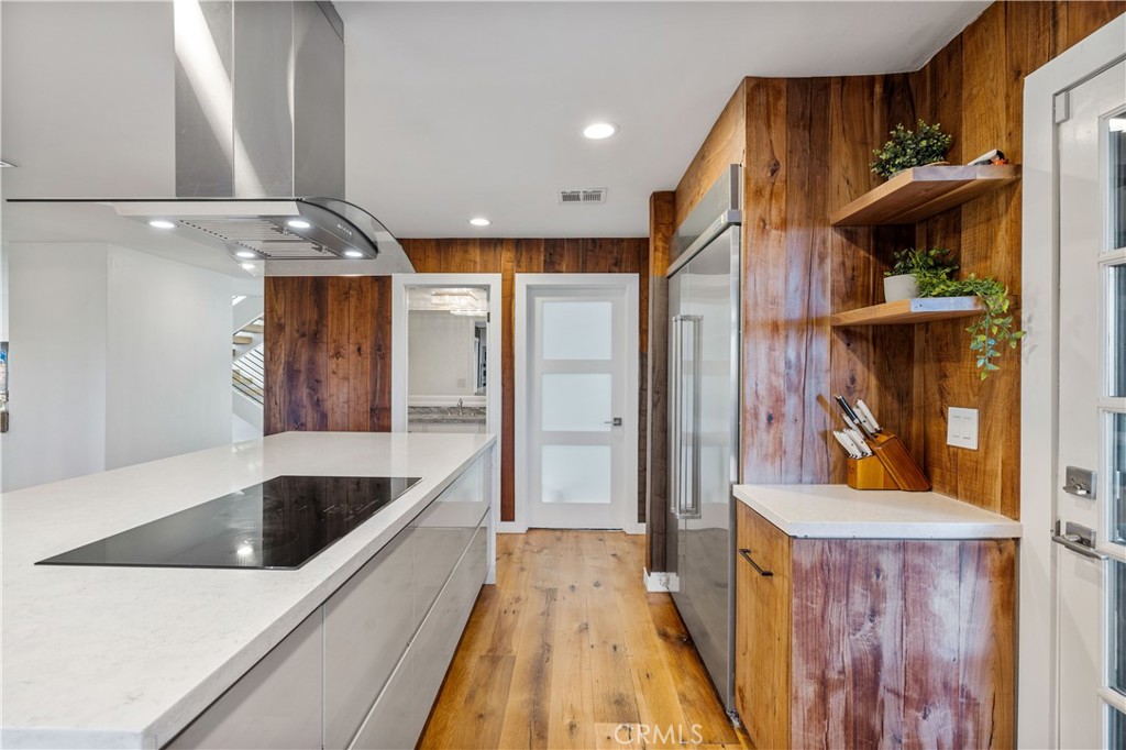 16337 Ravenglen Road Canyon Country, CA 91387 - Photo 11 of 50 a view of walk in closet with clothes and shoes