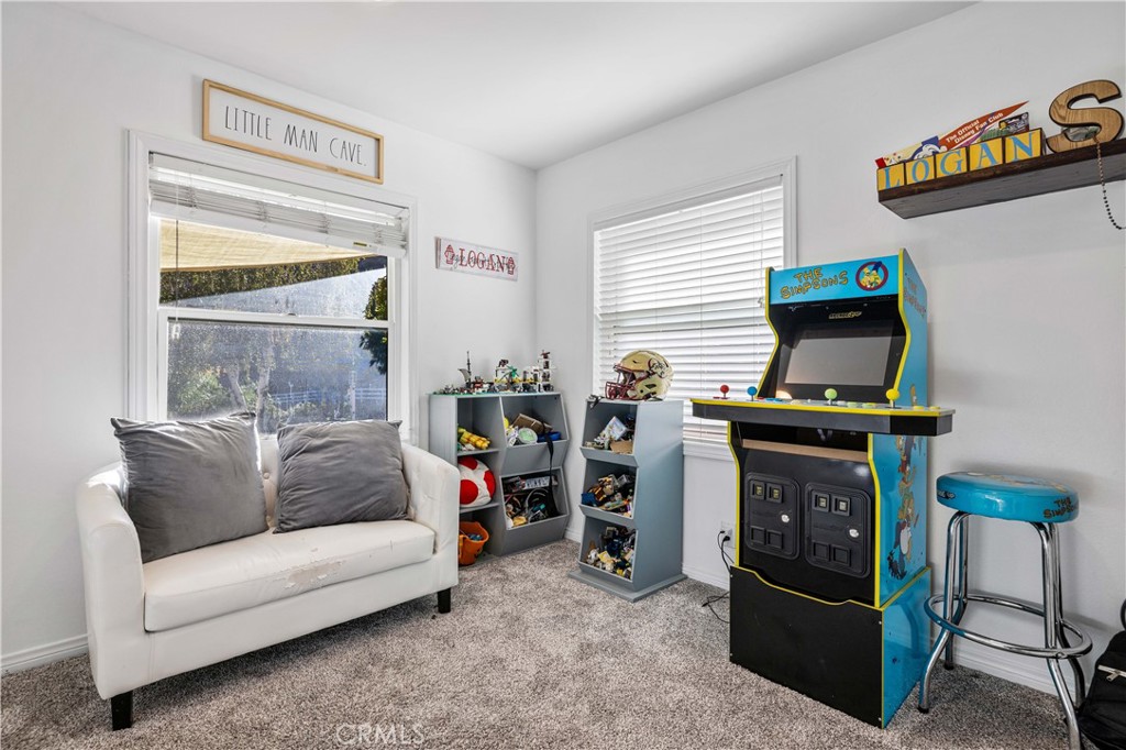 16337 Ravenglen Road Canyon Country, CA 91387 - Photo 18 of 50 a living room with furniture and a window
