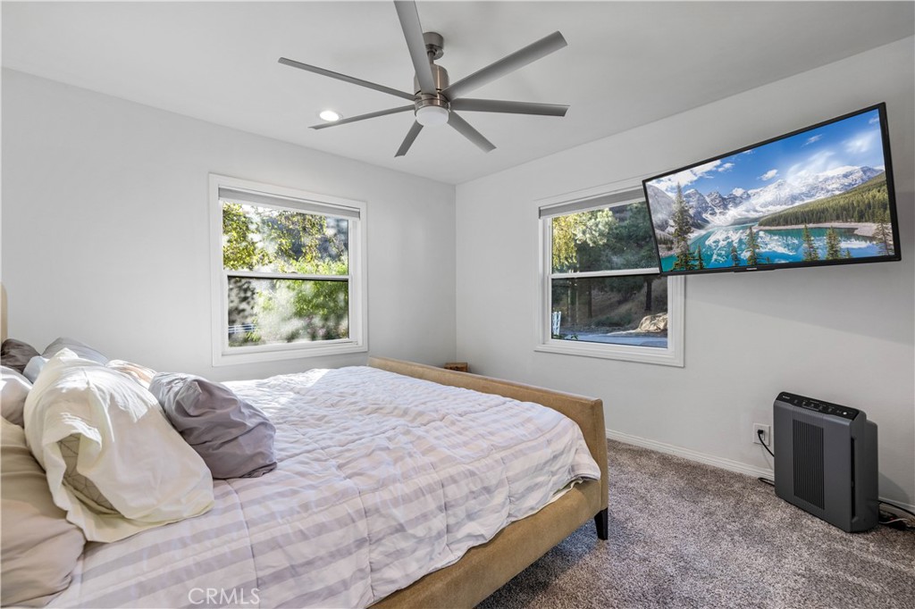 16337 Ravenglen Road Canyon Country, CA 91387 - Photo 21 of 50 a bedroom with a bed and a window