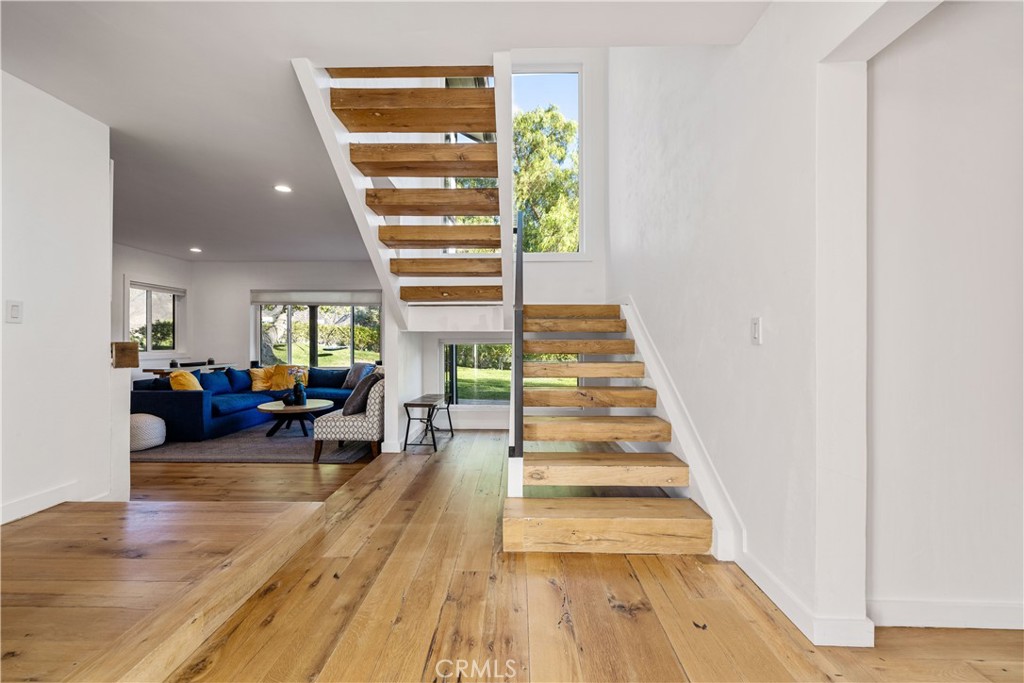 16337 Ravenglen Road Canyon Country, CA 91387 - Photo 23 of 50 a view of entryway and hall with wooden floor