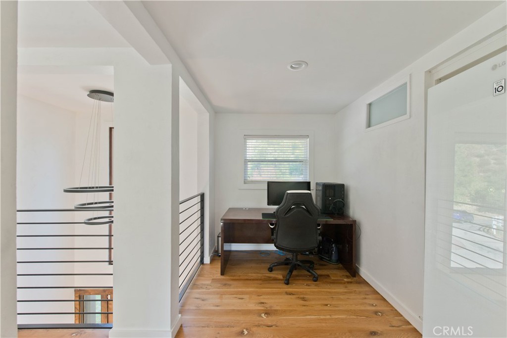 16337 Ravenglen Road Canyon Country, CA 91387 - Photo 25 of 50 a view of a workspace with furniture and a window