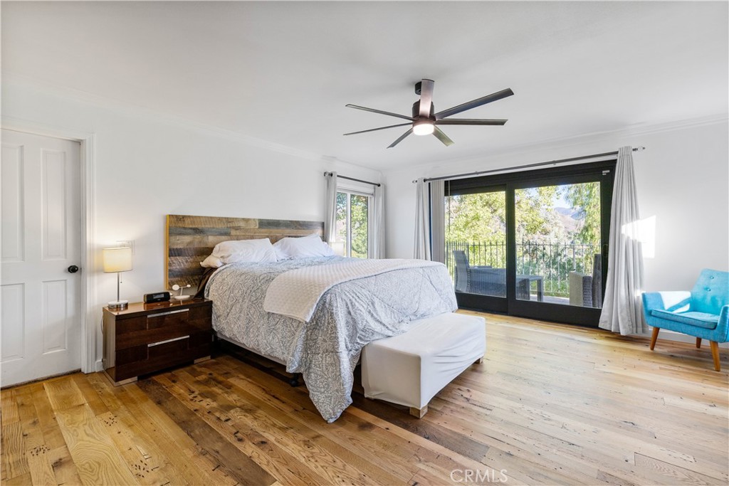 16337 Ravenglen Road Canyon Country, CA 91387 - Photo 27 of 50 a bedroom with a bed and large window