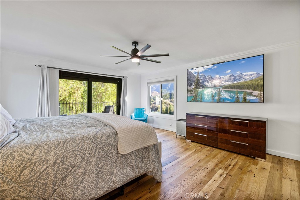 16337 Ravenglen Road Canyon Country, CA 91387 - Photo 28 of 50 a bed room with a bed and a television