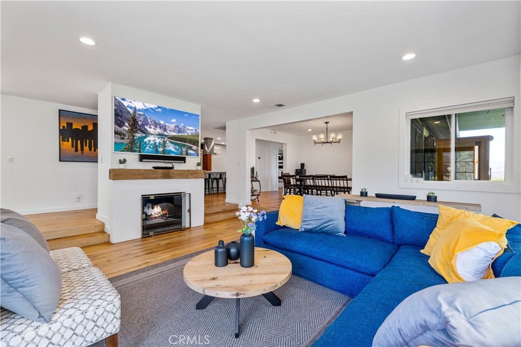 16337 Ravenglen Road Canyon Country, CA 91387 - Photo 3 of 50 a living room with furniture and a fireplace