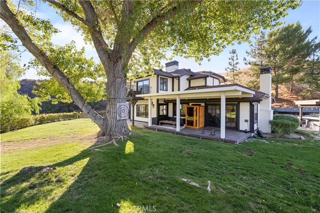16337 Ravenglen Road Canyon Country, CA 91387 - Photo 35 of 50 a view of a house with a yard balcony and sitting area