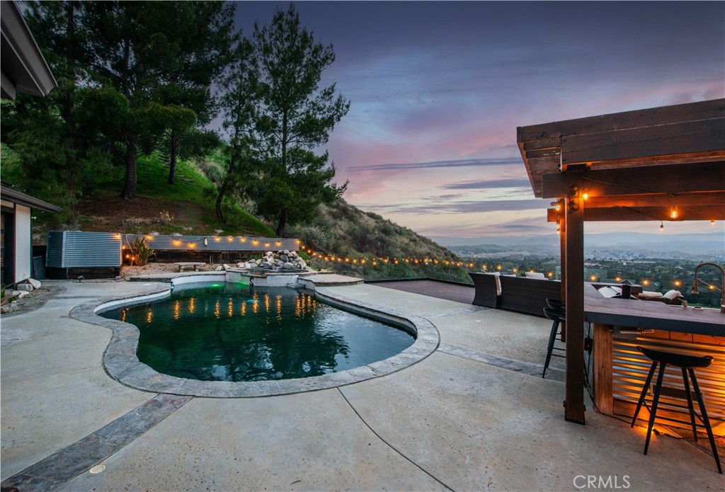16337 Ravenglen Road Canyon Country, CA 91387 - Photo 39 of 50 a view of a swimming pool with a patio