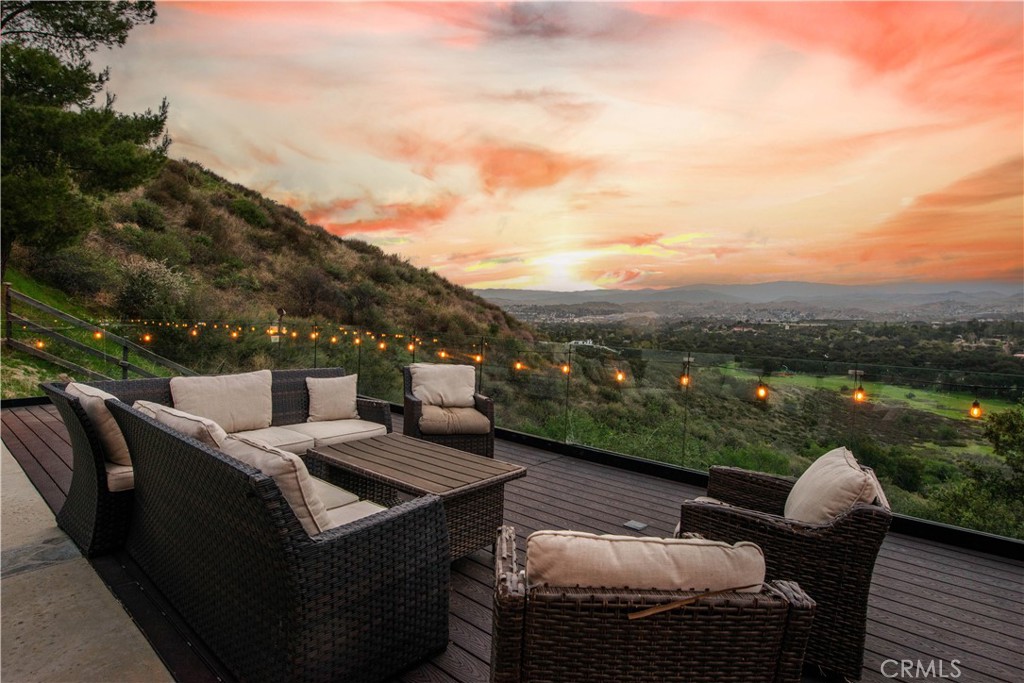 16337 Ravenglen Road Canyon Country, CA 91387 - Photo 43 of 50 a view of a terrace with couches and sky view