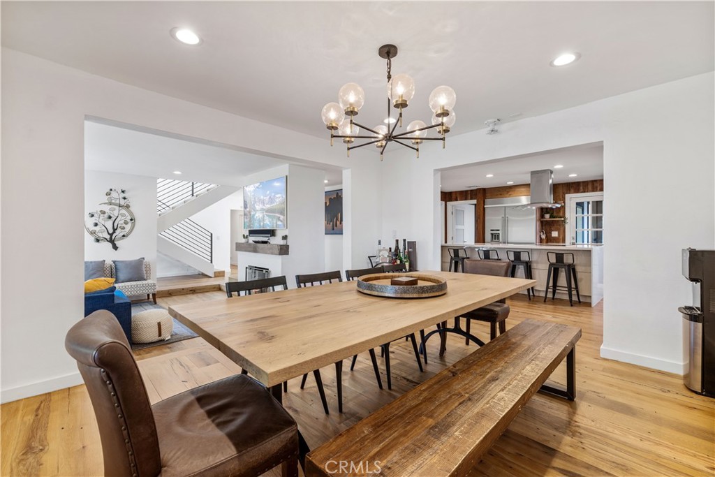 16337 Ravenglen Road Canyon Country, CA 91387 - Photo 6 of 50 a view of a dining room with furniture and wooden floor