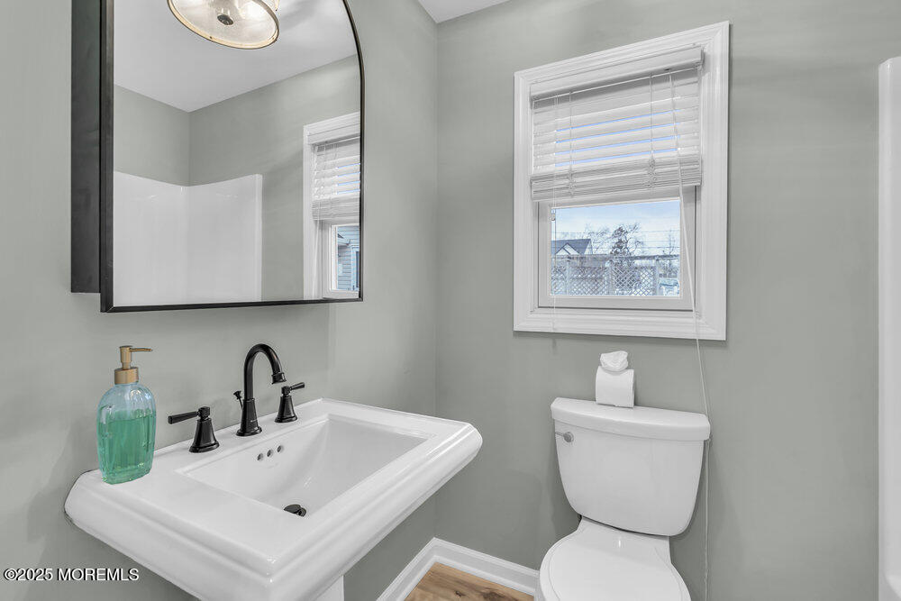 541 Ocean Boulevard Leonardo, NJ 07737 - Photo 11 of 29 a bathroom with a toilet sink and mirror