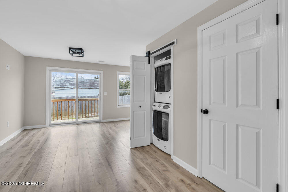 541 Ocean Boulevard Leonardo, NJ 07737 - Photo 13 of 29 a view of a hallway with wooden floor and a fireplace
