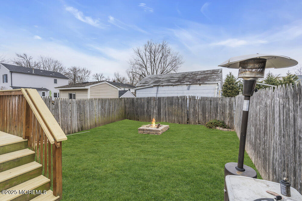541 Ocean Boulevard Leonardo, NJ 07737 - Photo 15 of 29 a backyard of a house with table and chairs