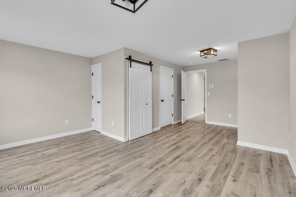 541 Ocean Boulevard Leonardo, NJ 07737 - Photo 21 of 29 a view of empty room with wooden floor and fan