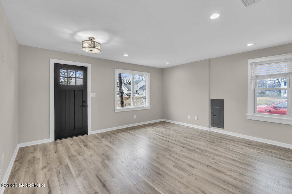 541 Ocean Boulevard Leonardo, NJ 07737 - Photo 5 of 29 a view of an empty room with wooden floor and a window