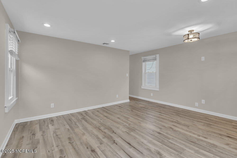 541 Ocean Boulevard Leonardo, NJ 07737 - Photo 7 of 29 wooden floor in an empty room with a window
