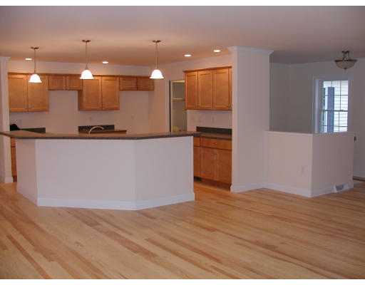 571 Burts Pit Road Northampton, MA 01062 - Photo 3 of 18 a large kitchen with stainless steel appliances a large counter top a refrigerator and a stove