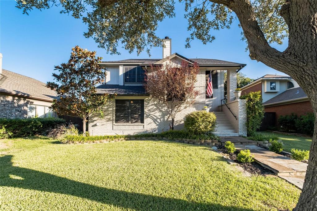 2939 Hunters Point Lane Carrollton, TX 75007 - Photo 1 of 29 a front view of a house with a yard