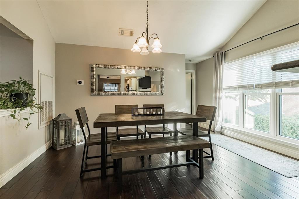 2939 Hunters Point Lane Carrollton, TX 75007 - Photo 2 of 29 a view of a a dining room with furniture window and wooden floor