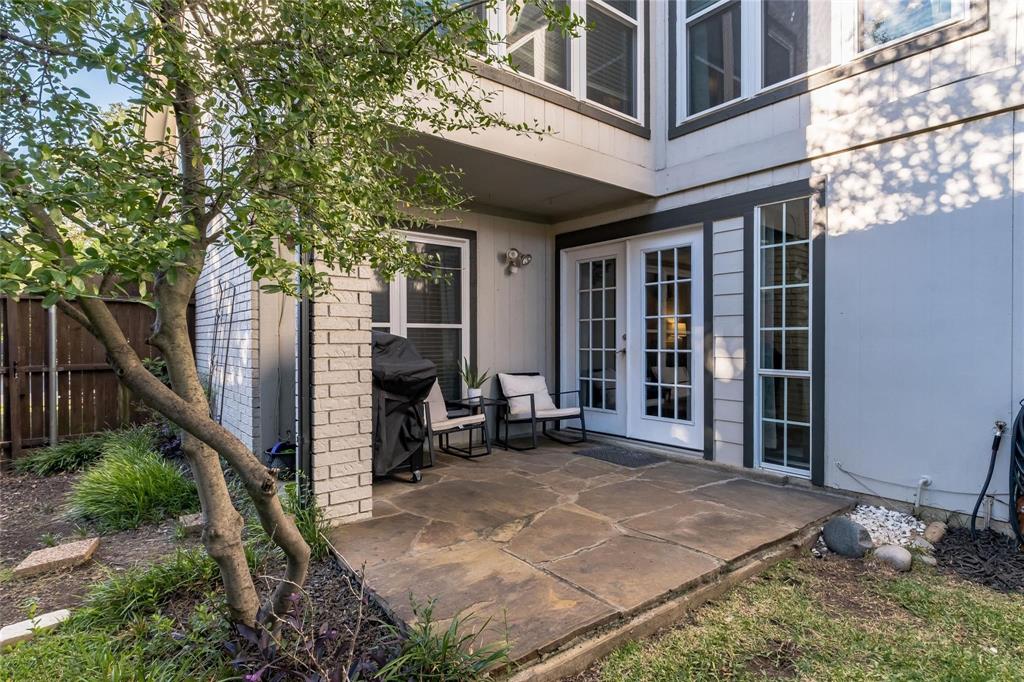 2939 Hunters Point Lane Carrollton, TX 75007 - Photo 28 of 29 a view of a building with backyard outdoor seating and hardwood