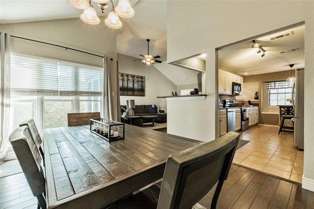 2939 Hunters Point Lane Carrollton, TX 75007 - Photo 3 of 29 a living room with stainless steel appliances kitchen island granite countertop furniture and a large window