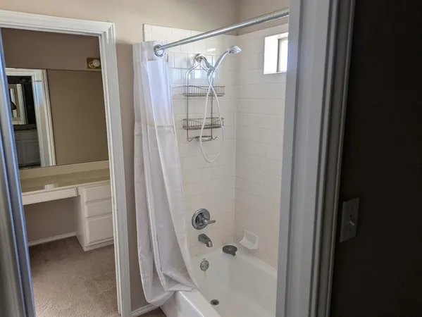 a bathroom with a sink and mirror