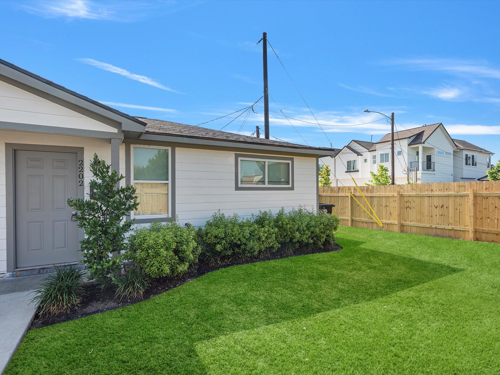 2202 Solo Street, Unit 2204 Houston, TX 77020 - Photo 2 of 21 a front view of a house with a garden and yard