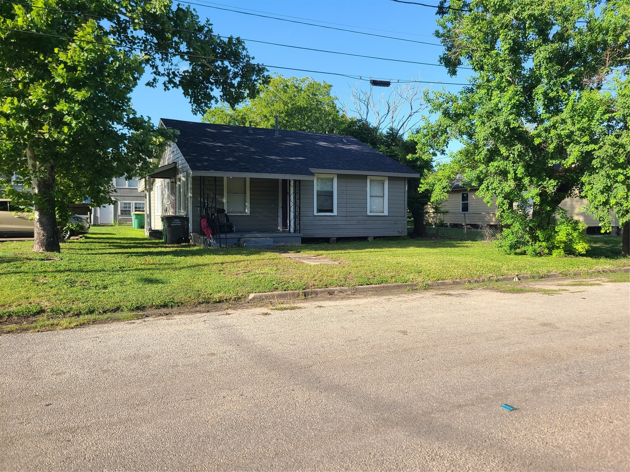 1314 East Power Avenue Victoria, TX 77901 - Photo 1 of 26 a view of a house with a big yard and large trees