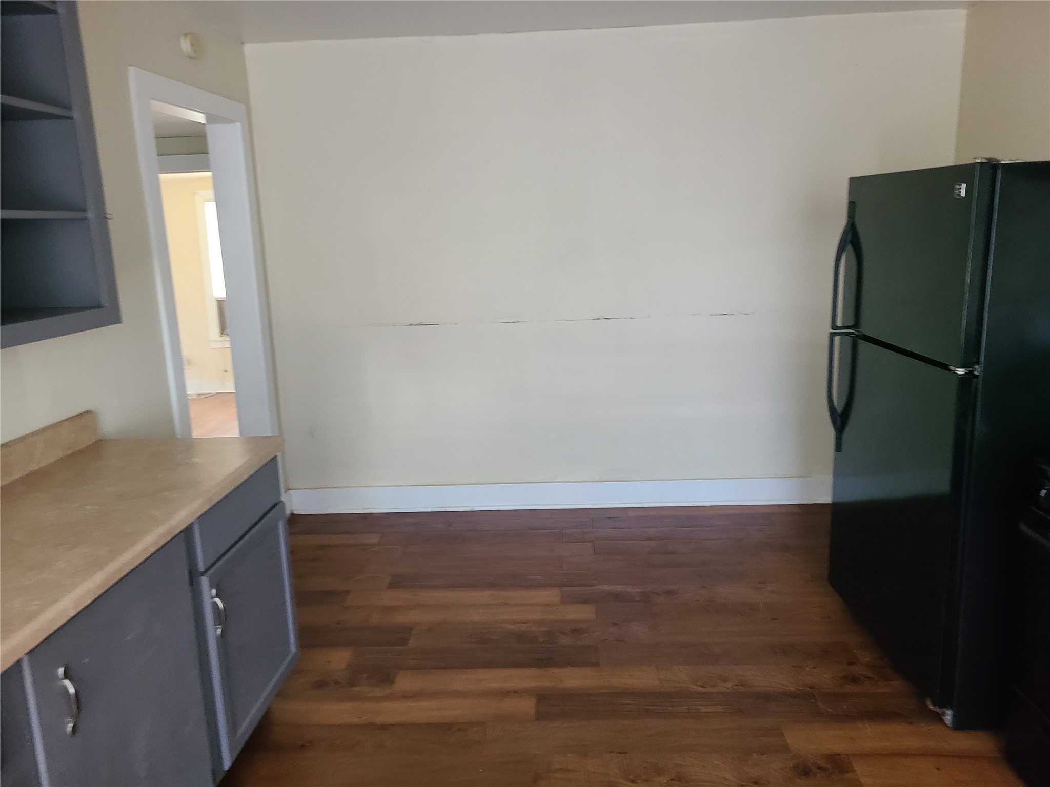 1314 East Power Avenue Victoria, TX 77901 - Photo 16 of 26 a view of a kitchen with a sink and a refrigerator