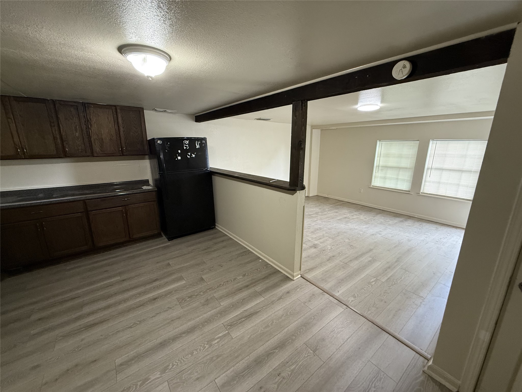1314 East Power Avenue Victoria, TX 77901 - Photo 19 of 26 a kitchen with granite countertop a refrigerator and a sink
