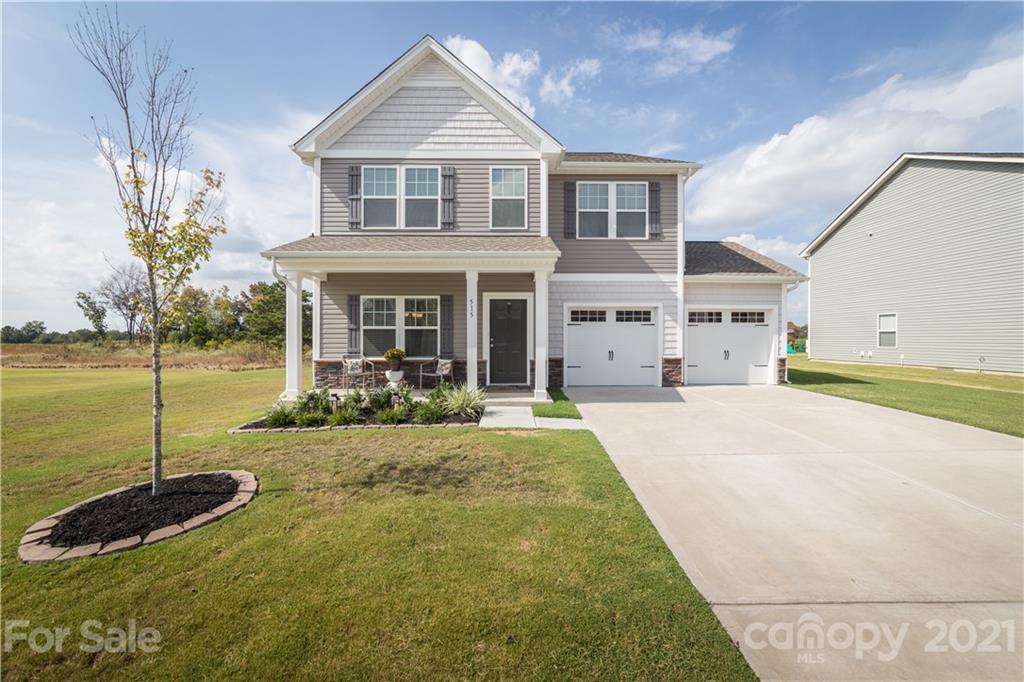 515 Comfort Way Locust, NC 28097 - Photo 2 of 31 a front view of a house with a yard