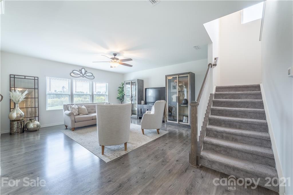 515 Comfort Way Locust, NC 28097 - Photo 13 of 31 a living room with furniture and a wooden floor