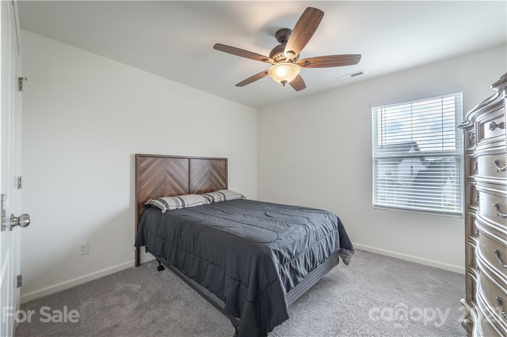 515 Comfort Way Locust, NC 28097 - Photo 18 of 31 a bedroom with a bed and window