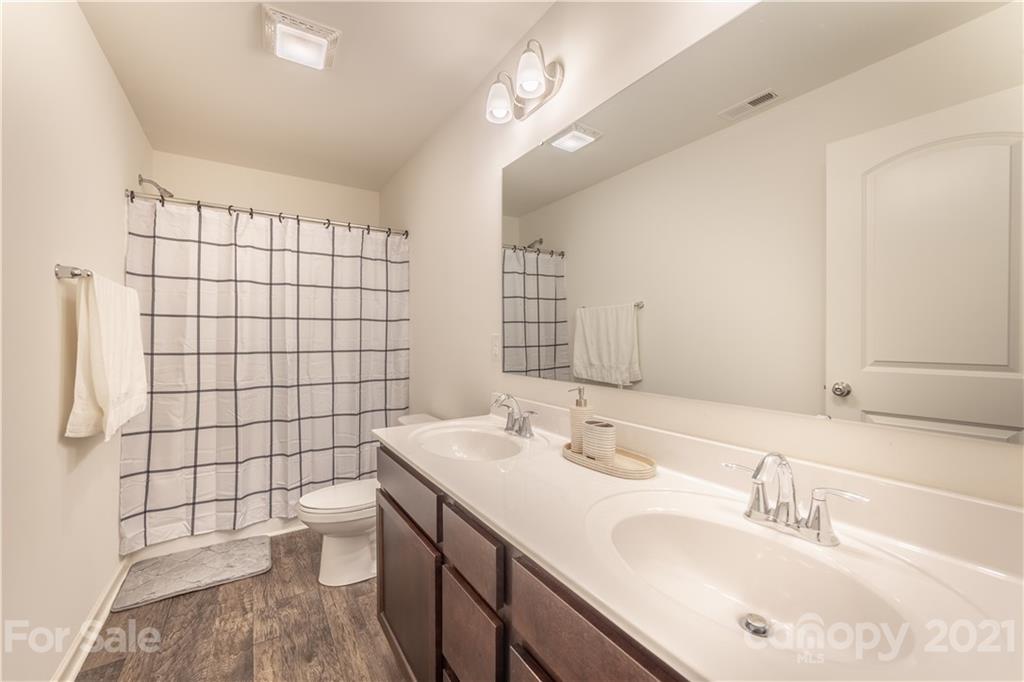 515 Comfort Way Locust, NC 28097 - Photo 21 of 31 a bathroom with a sink a toilet and shower