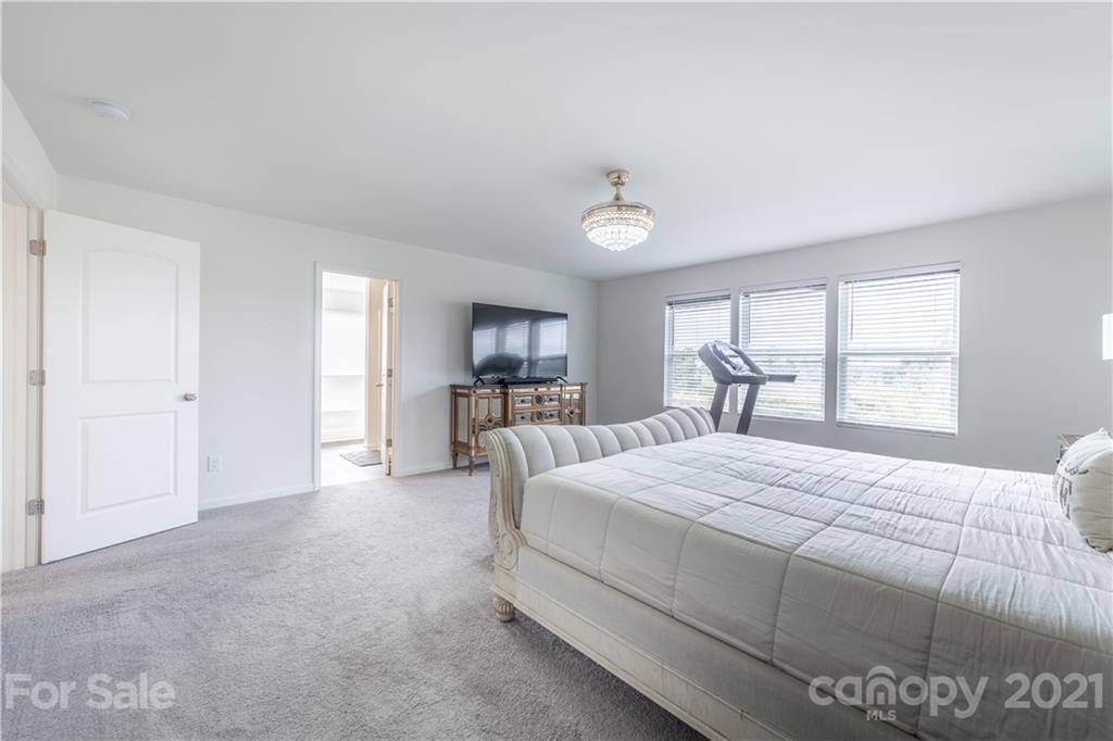 515 Comfort Way Locust, NC 28097 - Photo 24 of 31 a bedroom with a large bed and a window