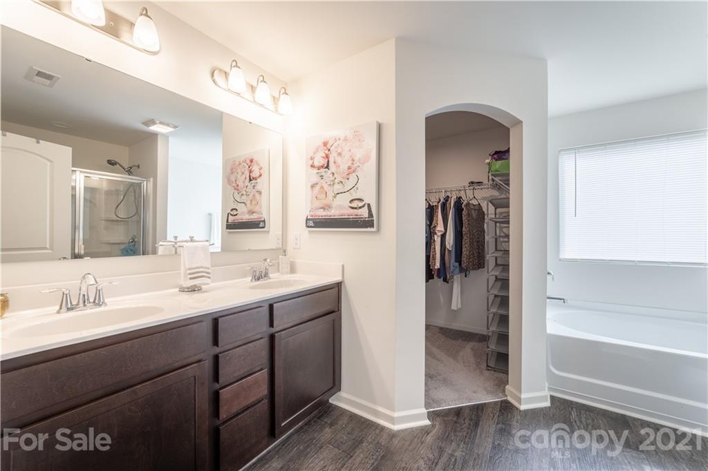 515 Comfort Way Locust, NC 28097 - Photo 25 of 31 a en suite bathroom with a sink and a mirror