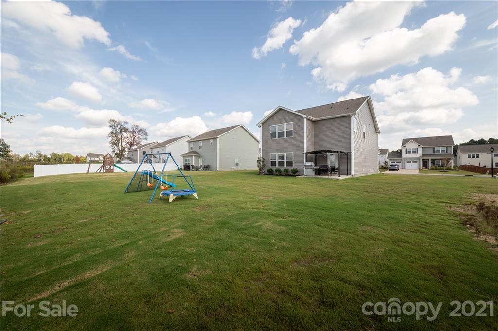 515 Comfort Way Locust, NC 28097 - Photo 28 of 31 a view of a house with a yard