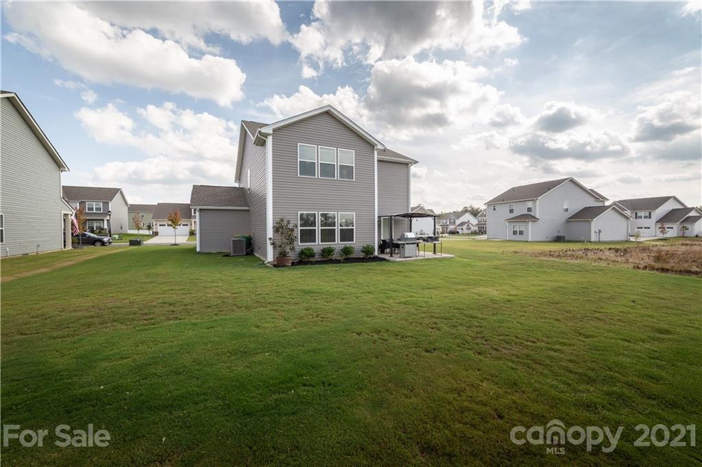 515 Comfort Way Locust, NC 28097 - Photo 29 of 31 a view of a house with a big yard