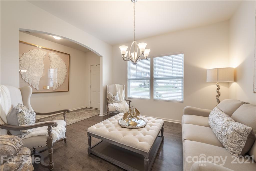515 Comfort Way Locust, NC 28097 - Photo 5 of 31 a living room with furniture chandelier and a table